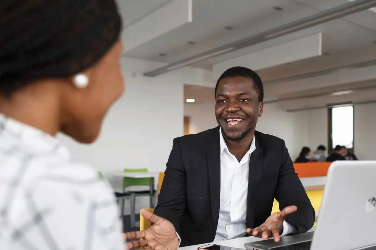 Two business students in discussion.