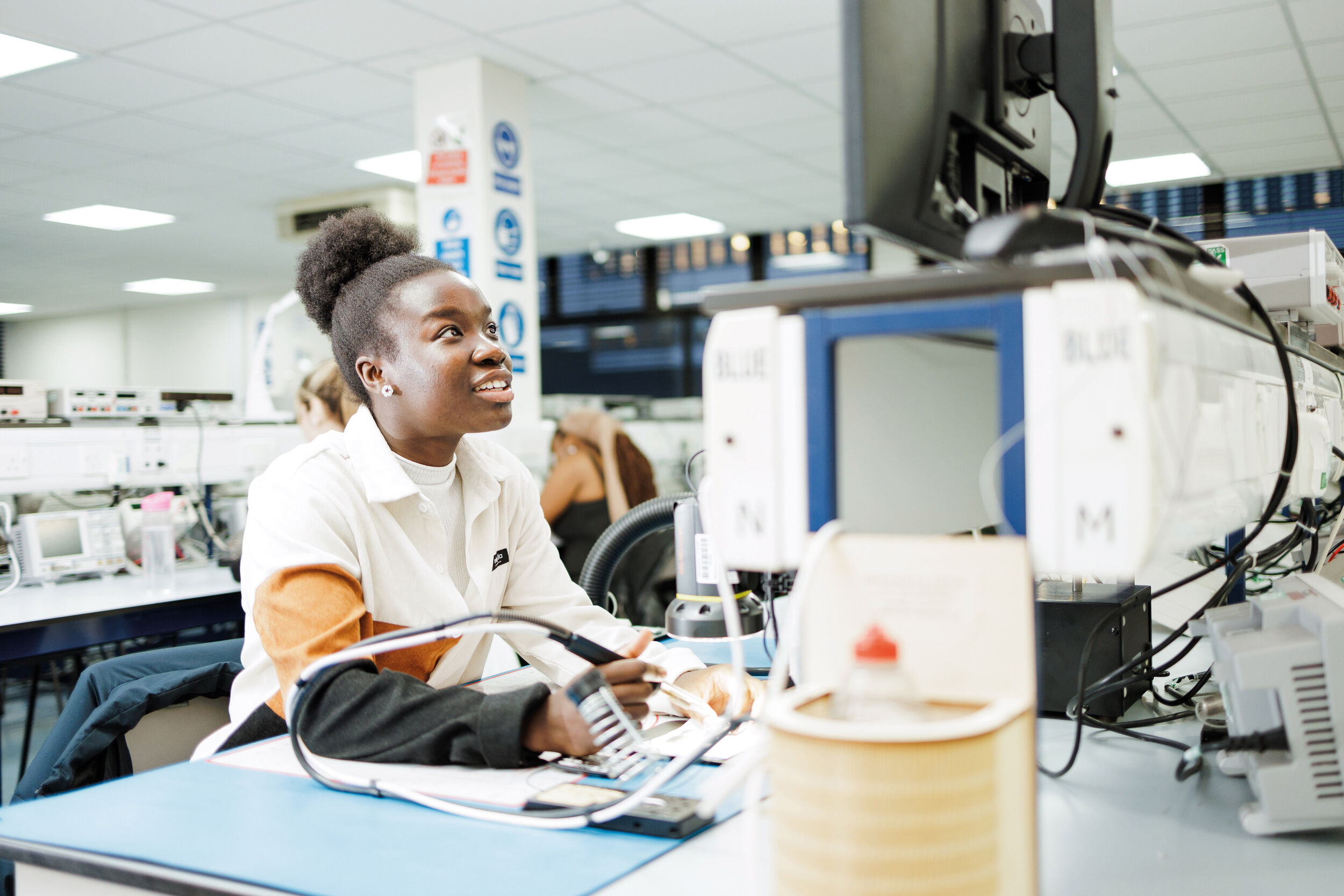 A University of Kent student works in an engineering lab.