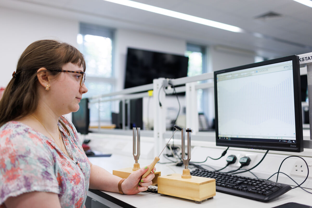 A University of Kent Physics student conducts an experiment.