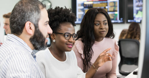 Kent Maths students looking at a PC screen.