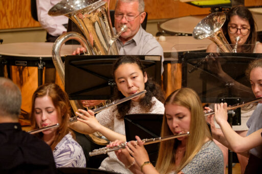 Members of the University Concert Band performing in Colyer-Fergusson Hall during Summer Music Week