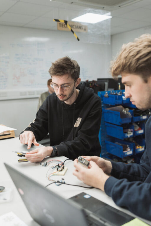 Two digital design students in a lab.